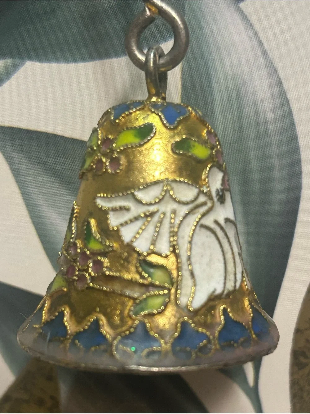 This is a Vintage Cloisonné Enamel Candle Snuffer.